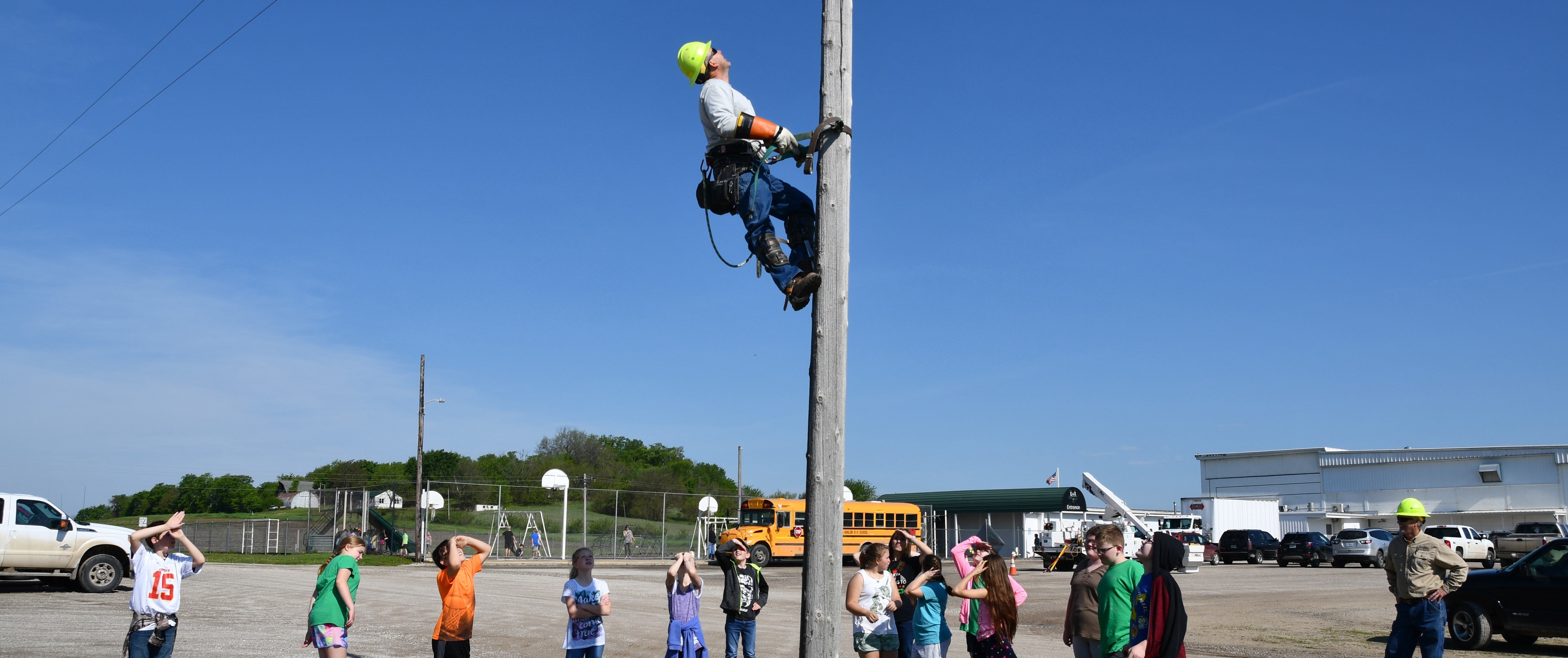 Lineman climbing an electric pole