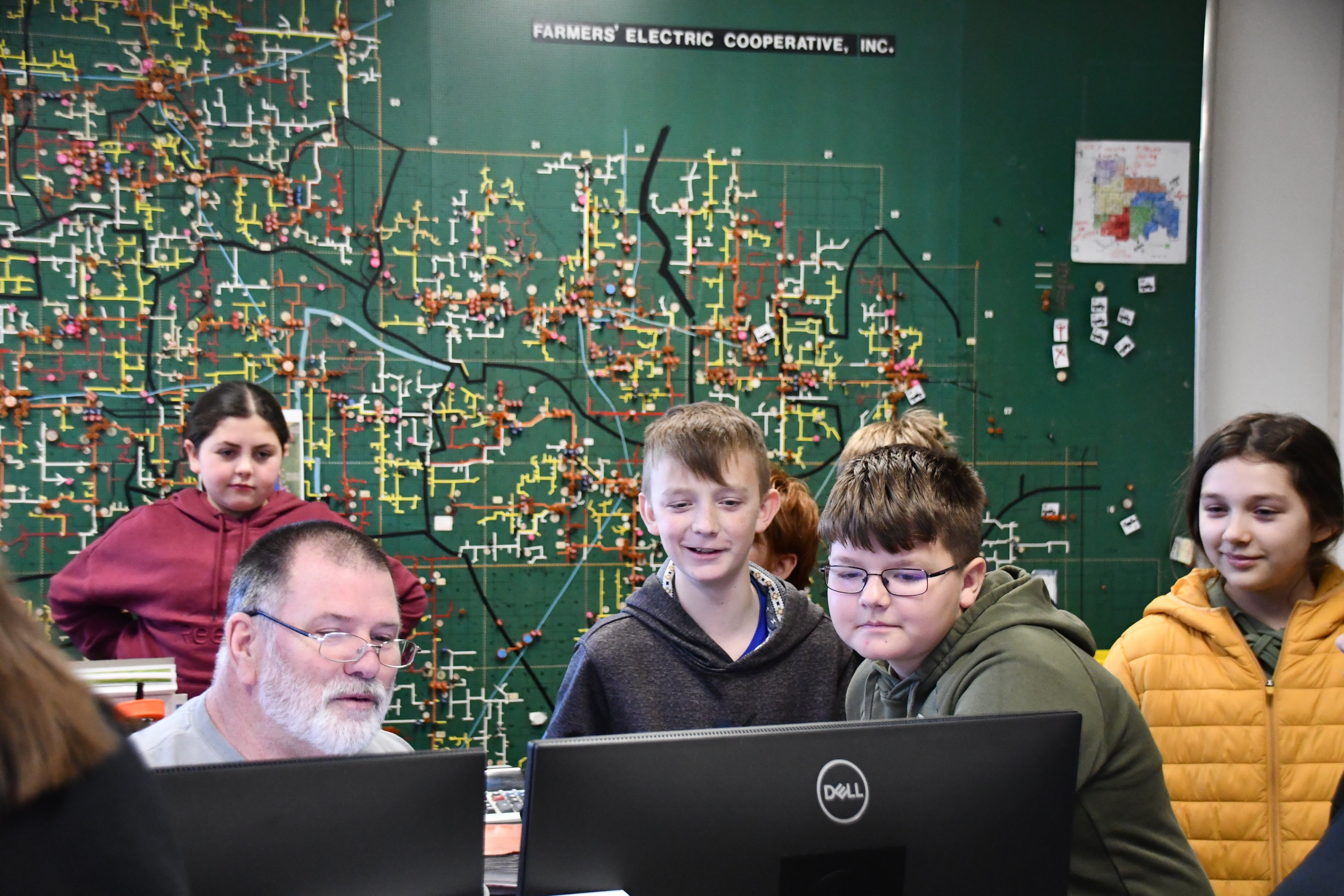 Dispatch showing students mapping software on computer